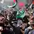A large crowd of protesters wave Palestinian flags in Berlin
