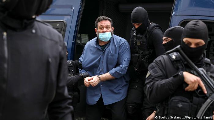 Far-right MEP Ioannis Lagos with armed Greek police 