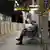 This picture taken on May 22, 2015 shows a businessman sleeping on a bench at a Tokyo train station