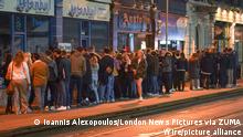 May 17, 2021, Sheffield, Yorkshire, UK: Sheffield ,UK. Students wait outside a bar in Sheffield as it prepares to serve customers after midnight to mark the latest lifting of lockdown measures.On Monday 17 May, pubs, bars and restaurants will welcome back customers indoors for the first time in more than five months, as Covid-19 restrictions are eased. (Credit Image: Â© Ioannis Alexopoulos/London News Pictures via ZUMA Wire