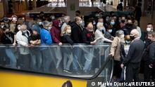 People wait to get shots of vaccines against the coronavirus disease (COVID-19) in the Usce shopping mall, where the first 100 vaccinated will receive a discount voucher worth 3,000 dinars ($30.74) secured by mall's management and retailers, in Belgrade, Serbia, May 6, 2021. REUTERS/Marko Djurica TPX IMAGES OF THE DAY