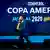 Brazilian former footballer Juninho Paulista carries the Copa America trophy in front of a screen with the Copa America logo