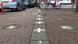 White crosses marking the border in Baarle, with 'B' for Belgium on one side, and 'NL' for Netherlands on the other White crosses marking the border in Baarle, with 'B' for Belgium on one side, and 'NL' for Netherlands on the other