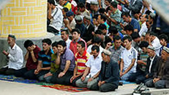 Uygurs offer Friday prayers at Id Kah Mosque in Kashgar in northwest China's Xinjiang Uygur Autonomous Region, Friday, July 2, 2010. Long-simmering tensions between Xinjiang's minority Uighurs and majority Han Chinese migrants turned into open violence in the streets of Urumqi, the capital of the traditionally Muslim region, last July. The government said 197 people were killed. (AP Photo/Kyodo News) ** JAPAN OUT, MANDATORY CREDIT, FOR COMMERCIAL USE ONLY IN NORTH AMERICA **