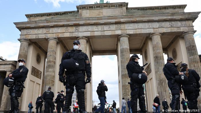 Police officers stand guard in front of Brandenburg Gate in Berlin
