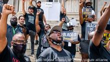Terrence Floyd, center, the brother of George Floyd, attends a rally on Sunday, May 23, 2021, in Brooklyn borough of New York. George Floyd, whose May 25, 2020 death in Minneapolis was captured on video, plead for air as he was pinned under the knee of former officer Derek Chauvin, who was convicted of murder and manslaughter in April 2021. (AP Photo/Eduardo Munoz Alvarez)