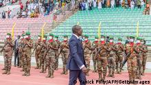 Newly-elected Benin's President Patrice Athanase Guillaume Talon reviews the guard of honor during his inauguration ceremony, at the Charles de Gaulle stadium, in Porto-Novo, on May 23, 2021. (Photo by Yanick Folly / AFP) (Photo by YANICK FOLLY/AFP via Getty Images)