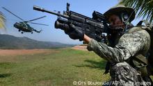 05.08.2015
Peruvian Army members are seen at the tactical VRAEM area, between the rivers Ene, Apurimac and Mantaro, some 280 km south east of Lima, on August 5, 2015, during operations against terrorism and drug trafficking in the region -- one of the largest coca production basins in the world and a natural hideout for guerrillas. Maoist group Sendero Luminoso (Shining Path), accountable for the conflict in Peru between 1980-2000 that left 69,000 dead, still has remnants causing havoc in remote villages. AFP PHOTO/CRIS BOURONCLE (Photo credit should read CRIS BOURONCLE/AFP via Getty Images)
