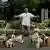 Man in Tokyo takes his many pet dogs for a walk