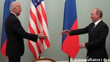 epa02625235 Russian Prime Minister Vladimir Putin (R) welcomes U.S. Vice President Joe Biden (L) during their meeting in Moscow, Russia 10 March 2011. Joe Biden is on a three-day visit in Russia. EPA/MAXIM SHIPENKOV