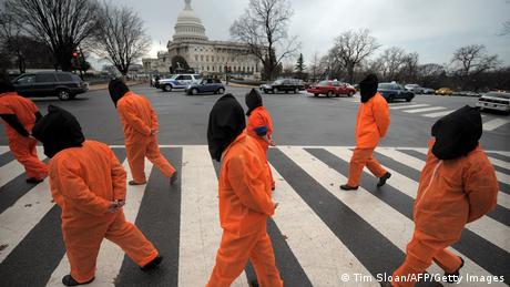 Amnesty International demonstrators representing prisoners at the US Guantanamo Bay Naval Base protest on the National Mall in Washington