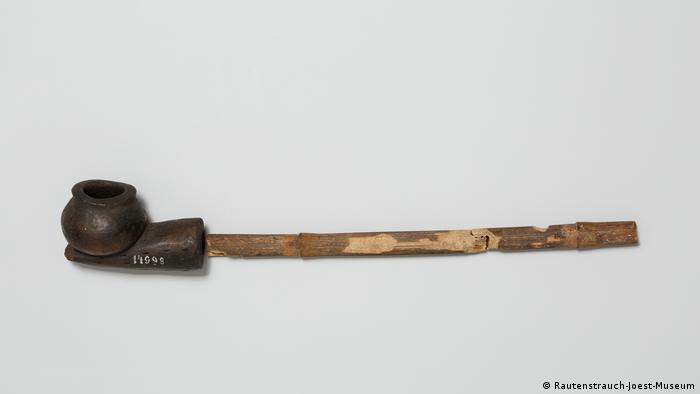 A long pipe with lying on a white background.