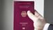 A hand holding a German passport A hand holding a German passport