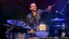 Ringo Starr plays as part of a concert celebrating the 50th anniversary of Woodstock in Bethel, N.Y., Friday, Aug. 16, 2019. Tie-dyed pilgrims and white-haired Woodstock festival veterans converged at the generation-defining site to celebrate its 50th anniversary, while Arlo Guthrie came back to sing — what else? — The Times They Are a-Changin'. Bethel Woods Center for the Arts is hosting a series of events Thursday through Sunday at the bucolic 1969 concert site, 80 miles (130 kilometers) northwest of New York City. (AP Photo/Seth Wenig)