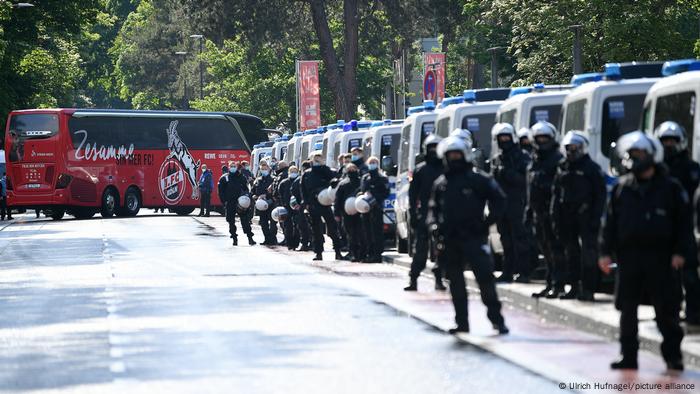 Police stand ready outside a Cologne football stadium in 2021