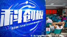 22.07.2019
©/MAXPPP - NANJING, CHINA - JULY 22: Investors sit next to a poster of the SSE STAR Market at a stock exchange hall on July 22, 2019 in Nanjing, Jiangsu Province of China. The Shanghai Composite Index dropped 37.23 points, or 1.27 percent, to close at 2,886.97 points. (Photo by VCG)