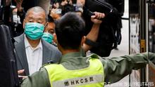 FILE PHOTO: Media mogul Jimmy Lai, founder of Apple Daily, leaves the Court of Final Appeal by prison van in Hong Kong, China February 9, 2021. REUTERS/Tyrone Siu/File Photo