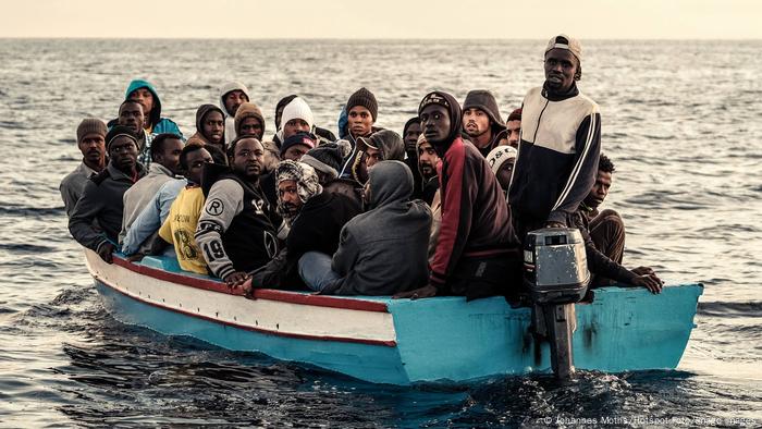 Migrants in a small boat across the Mediterranean