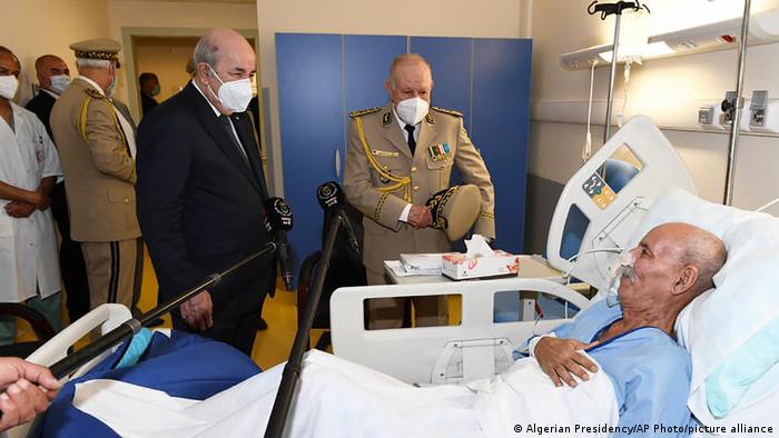 Algerian President Abdelmajid Tebboune (left) visiting Polisario Front leader Brahim Ghali in hospital