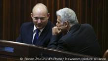 02.06.2021***Yamina party leader Naftali Bennett (L) smiles as he speaks to Yesh Atid party leader Yair Lapid during a special session of the Knesset where Israeli lawmakers elected Isaac Herzog as the new president in Jerusalem on Wednesday, June 2, 2021. Yair Labid hopes to form a new government to replace Netanyahu as Prime Minister later today. Pool Photo by Ronen Zvulun/UPI Photo via Newscom picture alliance