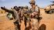 French soldiers with Malian counterparts in the Sahel. French soldiers with Malian counterparts in the Sahel.