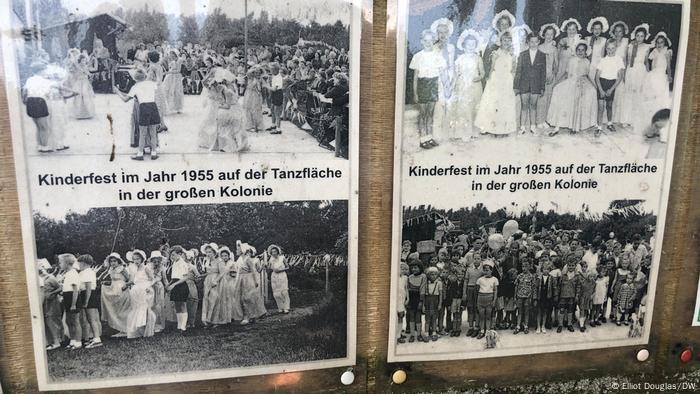 An information board shows the community at the garden in the past An information board shows the community at the garden in the past