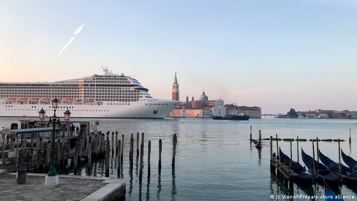 The cruise ship MSC Orchestra makes its way down the Giudecca Canal in Venice, Italy