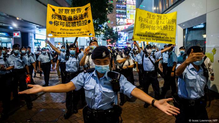 Police move to disperse Hong Kong residents gathering in the Causeway Bay district of Hong Kong.