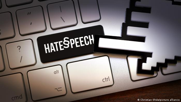 PIcture showing a keyboard with the words 'hate speech,'on it. 