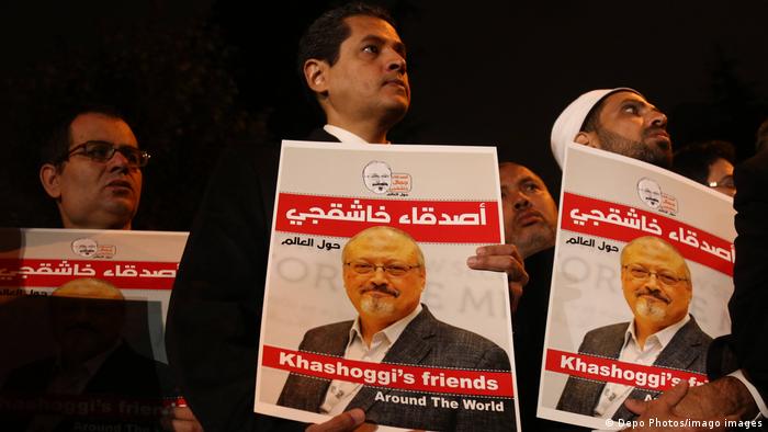 People hold pictures of Jamal Khashoggi during the demonstration in front of Saudi Arabian Consulate in Istanbul.