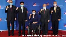 U.S. Senators Tammy Duckworth (D-IL), Dan Sullivan (R-AK) and Chris Coons (D-DE) pose for a group picture with Taiwan Foreign Minister Joseph Wu and Brent Christensen, director of the American Institute in Taiwan, at a news conference in Taipei, Taiwan June 6, 2021. Central News Agency/Pool via REUTERS