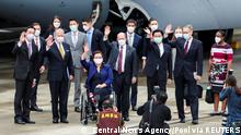 U.S. Senators Tammy Duckworth (D-IL), Dan Sullivan (R-AK) and Chris Coons (D-DE) wave next to Taiwan Foreign Minister Joseph Wu and Brent Christensen, director of the American Institute in Taiwan, after their arrival via a U.S. Air Force freighter at Taipei Songshan Airport in Taipei, Taiwan June 6, 2021. Central News Agency/Pool via REUTERS