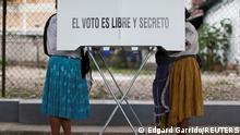 People fill out their ballots at a polling station during mid-term election in Atzacoaloya, Guerrero state, Mexico, June 6, 2021. REUTERS/Edgard Garrido