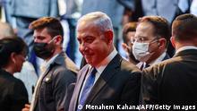 Israeli Prime Minister Benjamin Netanyahu (C) and Cabinet Secretary Tzahi Braverman (R) attend a Health Ministry-organised appreciation ceremony for health system personnel and partner agencies for their contribution against the COVID-19 coronavirus pandemic, in Jerusalem on June 6, 2021. (Photo by Menahem KAHANA / AFP) (Photo by MENAHEM KAHANA/AFP via Getty Images)
