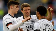 Germany's midfielder Serge Gnabry (R) celebrates scoring the 5-0 goal with Germany's midfielder Kai Havertz (L) and Germany's forward Thomas Mueller during the friendly football match between Germany and Latvia in Duesseldorf, western Germany, on June 7, 2021, in preparation for the UEFA European Championships. (Photo by Odd ANDERSEN / AFP)