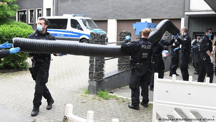 Police officers in Essen in western Germany, conducting a search in front of an office building. June 7, 2021.
