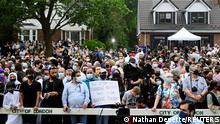 People attend a vigil outside the London Muslim Mosque organized after four members of a Canadian Muslim family were killed in what police describe as a hate-motivated attack in London, Ontario, Canada, June 8, 2021. Nathan Denette/Pool via REUTERS