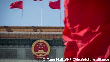 Red flags flutter in front of the Great Hall of the People during the opening meeting for the second session of the 13th National People's Congress (NPC) in Beijing, China, 5 March 2019. China must be prepared for a tough struggle as the country faces a grave and more complicated environment, Premier Li Keqiang said at the opening of the annual National People's Congress on Tuesday, the country's annual parliamentary meeting. We must be fully prepared for a tough struggle, Li told a delegation of nearly 3,000 representatives. The difficulties we face must not be underestimated, our confidence must not be weakened, and the energy we bring to our work must not be allowed to wane. This year's meeting comes amid tariff tensions with the U.S. ¡ª China's largest trading partner ¡ª which have placed immense pressure on China's economy and financial markets. In prepared remarks, according to an official English handout, Li warned that there will be greater risks ahead for the world's second largest economy. A full analysis of developments in and outside China shows that in pursuing development this year, we will face a graver and more complicated environment as well as risks and challenges, foreseeable and otherwise, that are greater in number and size, Li said.