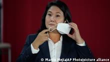 Presidential candidate Keiko Fujimori takes off her mask during a press conference in Lima, Peru, Wednesday, June 0, 2021. Peruvians are still waiting to learn who will become their president next month as votes from Sunday’s runoff election continued to be counted and the tiny difference between the two polarizing populist candidates, Fujimori and Pedro Castillo narrowed. (AP Photo/Martin Mejia)