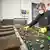 A worker at battery recycling specialist Redux sorting household batteries on a conveyor belt. 