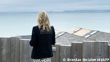 TOPSHOT - US First Lady Jill Biden, wearing a jacket with the words 'love' on the back, poses for a photograph looking out over the sea, at Carbis Bay, in Cornwall on June 10, 2021, ahead of the three-day G7 summit being held from 11-13 June. - G7 leaders from Canada, France, Germany, Italy, Japan, the UK and the United States meet this weekend for the first time in nearly two years, for the three-day talks in Carbis Bay, Cornwall. (Photo by Brendan Smialowski / AFP)