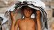 A child labor working at a tannery factory in Hazaribagh at Dhaka A child labor working at a tannery factory in Hazaribagh at Dhaka