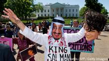Protestors with Code Pink stage a mock beheading in front of the White House April 20, 2016, Washington, DC to bring attention to the plight of three Saudi Arabian youths, Ali al-Nimr, Dawood al-Marhoon, and Abdullah al-Saher, all sentenced to death for participating in nonviolent protests against the Saudi regime.
All three were arrested at different times in 2012, when they were all under the age of 18, and sentenced to death in 2014. / AFP / PAUL J. RICHARDS (Photo credit should read PAUL J. RICHARDS/AFP via Getty Images)