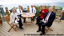 From left, European Commission President Ursula von der Leyen, French President Emmanuel Macron, European Council President Charles Michel, German Chancellor Angela Merkel and Italy's Prime Minister Mario Draghi gather for an EU coordination meeting prior to the G7 meeting at the Carbis Bay Hotel in Carbis Bay, St. Ives, Cornwall, England, Friday, June 11, 2021. Leaders of the G7 begin their first of three days of meetings on Friday, in which they will discuss COVID-19, climate, foreign policy and the economy. (Phil Noble, Pool via AP)