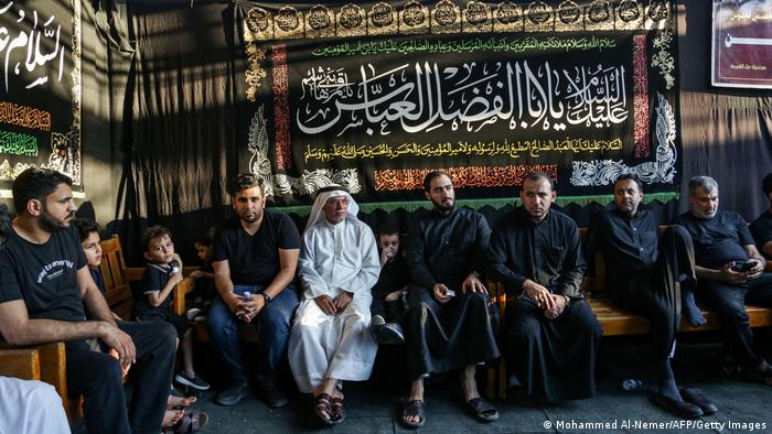 Shiite Muslims sit in a mourning tent during a commemoration of the Shiite Muslim religious holiday of Ashura in the eastern Saudi city of Qatif.