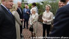 Britain's Queen Elizabeth II speaks to US President Joe Biden and his wife Jill Biden during reception with the G7 leaders at the Eden Project in Cornwall, England, Friday June 11, 2021, during the G7 summit. (Jack Hill/Pool via AP)