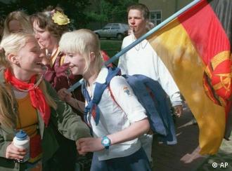 School children dressed in former East German communist youth organization uniforms-