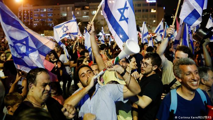  People celebrate after Israel's parliament voted in a new coalition government