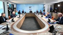 (From centre clockwise) British Prime Minister Boris Johnson, US President Joe Biden, France's President Emmanuel Macron, Canada's Prime Minister Justin Trudeau, Japan's Prime Minister Yoshihide Suga, President of the European Council Charles Michel, Italy's Prime minister Mario Draghi, Australia's Prime Minister Scott Morrison, Germany's Chancellor Angela Merkel, South Africa's President Cyril Ramaphosa and South Korea's President Moon Jae-in attend a working sesssion at the G7 summit in Carbis Bay, Cornwall on June 12, 2021. - G7 leaders from Canada, France, Germany, Italy, Japan, the UK and the United States meet this weekend for the first time in nearly two years, for three-day talks in Carbis Bay, Cornwall. (Photo by Leon Neal / POOL / AFP) (Photo by LEON NEAL/POOL/AFP via Getty Images)