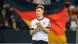 Joshua Kimmich standing in front of a Germany flag Joshua Kimmich standing in front of a Germany flag